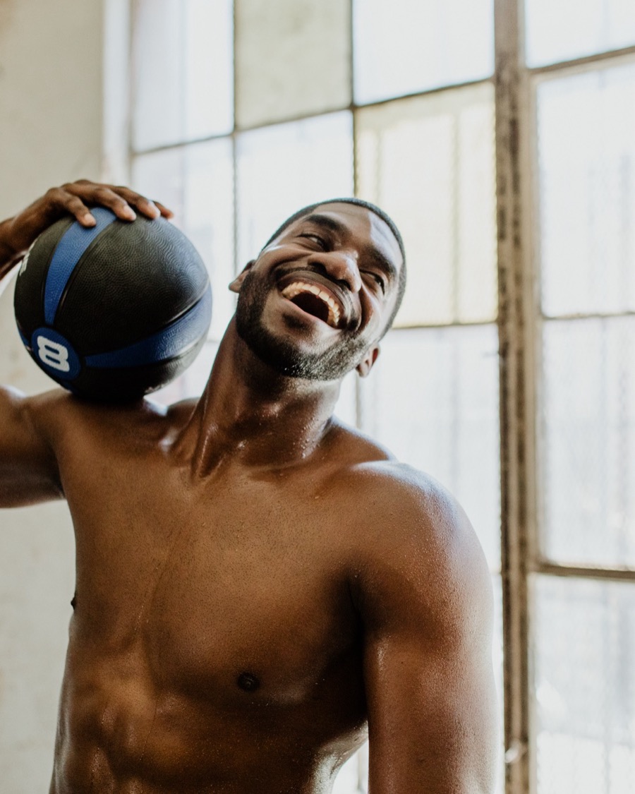 Calvin laughing with a medicine ball